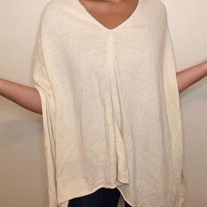 White loosely fitted cape like shirt